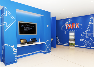 Photo of a room in the Bayer campus with a blue wall that reads, "The Park"