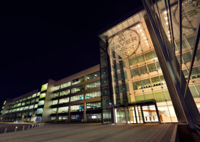 Photo of the exterior of the Bayer Building at night